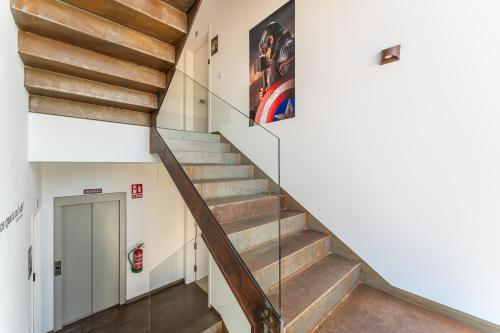 a staircase in a building with a stair case at CMDreams Platinium- Apartamentos turísticos en el centro de Mérida in Merida