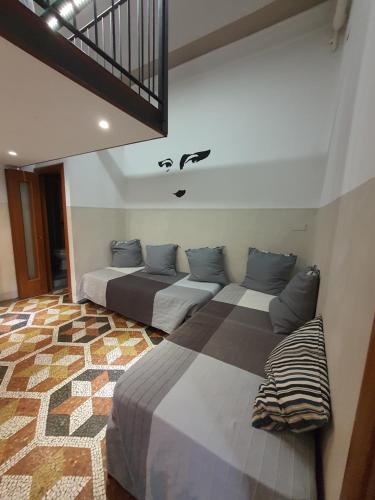 Кровать или кровати в номере Albergo Avalon