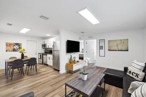 a living room with a kitchen and a dining room at Harbourside Flats in Fort Lauderdale