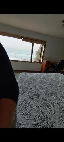 Tempat tidur dalam kamar di Casa playa ConCon
