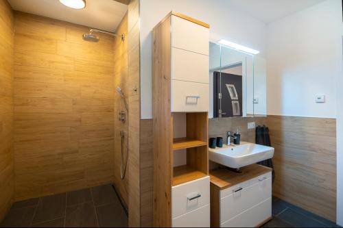 a bathroom with a sink and a shower at Haus Nani in Bad Gastein