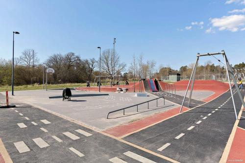 a park with a skate park with a playground at Stockholm Private Rooms in Shared Lovely, Amazing, Modern Apartment +Garden +BBQ in Stockholm