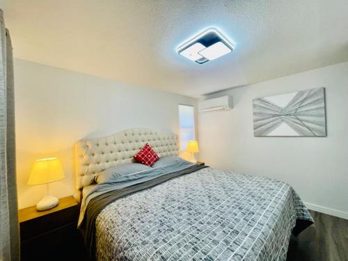 a bedroom with a bed and a window at Modern Home with Air Conditioners Near Bitter Lake in Seattle