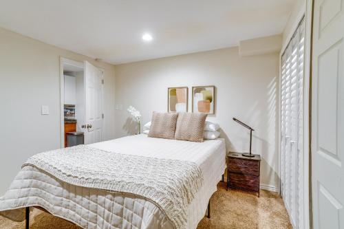 a white bedroom with a bed and a window at Aurora Vacation Rental 9 Mi to Downtown Denver in Aurora