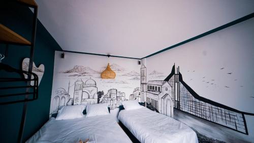 เตียงในห้องที่ Prishtina In & Out