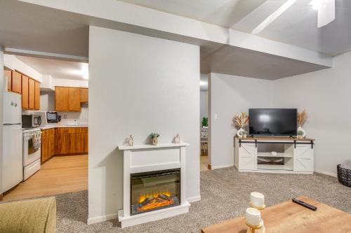 a living room with a fireplace and a tv at Sturgis Apt 1 Mi to Sturgis Motorcycle Rally! in Sturgis