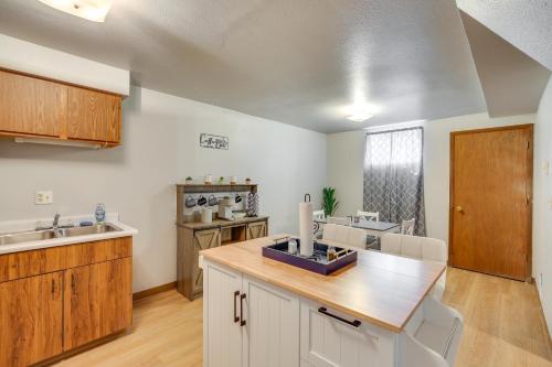 a kitchen with white cabinets and a wooden counter top at Sturgis Apt 1 Mi to Sturgis Motorcycle Rally! in Sturgis