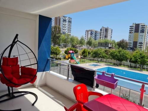 a balcony with a view of a swimming pool at Cozy two-room apartment for living in Erdemli