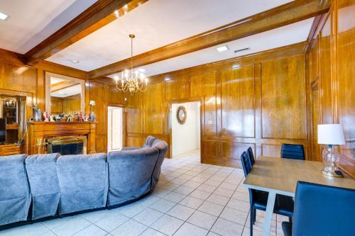 a living room with a couch and a table at Charming Texas Escape, Near Cedar Hill State Park! in Duncanville