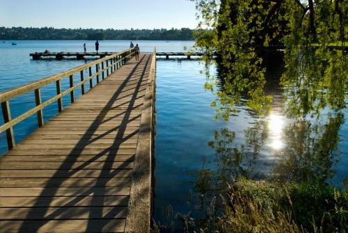 a wooden bridge over a body of water at Green Lake 1st Line Home B with Central Air Conditioners in Seattle