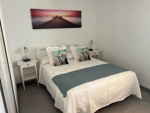 Ένα ή περισσότερα κρεβάτια σε δωμάτιο στο Apartamento Vista Mar ,Playas de Jandia Esquinzo