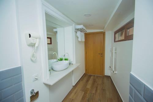 a bathroom with a sink and a mirror at Boutique Stay in Tbilisi City