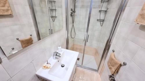 a bathroom with a sink and a shower at Last Minute Booking in Peschiera del Garda