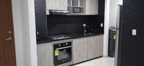 Dapur atau dapur kecil di Apartment in Sanatamarta with Beach 20’