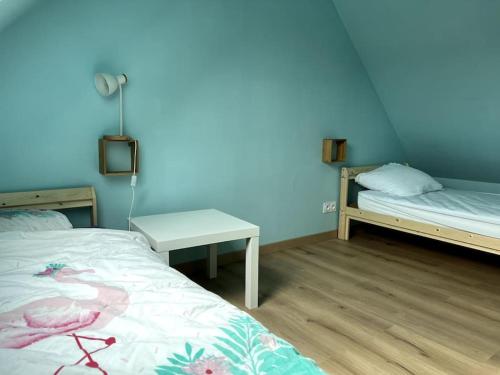 Katil atau katil-katil dalam bilik di Maison à 3 min de Cabourg / 5min à pieds de la mer