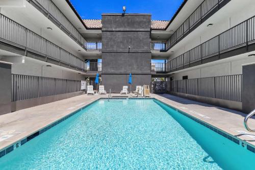 a swimming pool in a large building with a swimming pool at Motel 6-Escondido, CA in Escondido