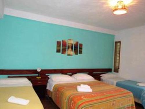 Postel nebo postele na pokoji v ubytování HOTEL LA TOSCANA