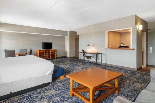 a hotel room with a bed and a table at Bangor Aviator Hotel BW Premier Collection in Bangor