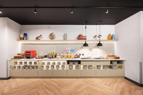 a kitchen with a counter with lots of food at Staybridge Suites Brighton by IHG in Brighton & Hove