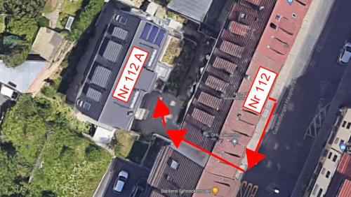 an aerial view of a building with red arrows at City Suite Gablenberg in Stuttgart
