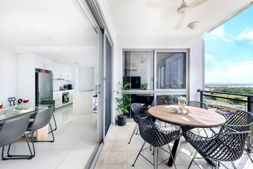 a kitchen and dining room with a table and chairs at 'Top of Town' Resort-style Stay in Heart of Darwin in Darwin