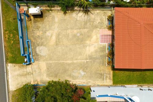 an overhead view of a building with a red roof at Jobos Beach Apt #2 near food truck and beach in Isabela