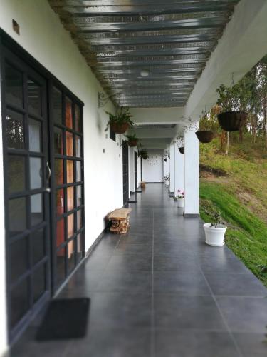 an empty hallway of a building with a ceiling at Casablanca Choachi in Choachí