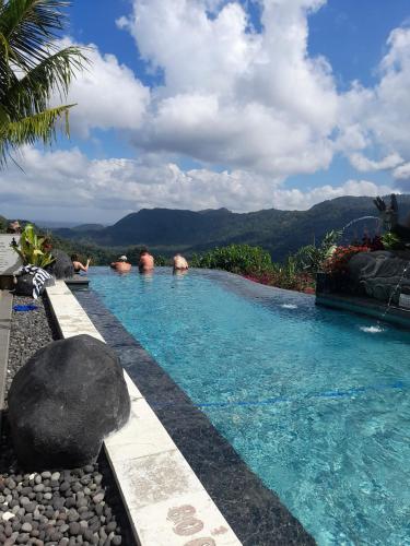 a swimming pool with a view of a mountain at Bella Kita Mountain Retreat & Spa in Klungkung