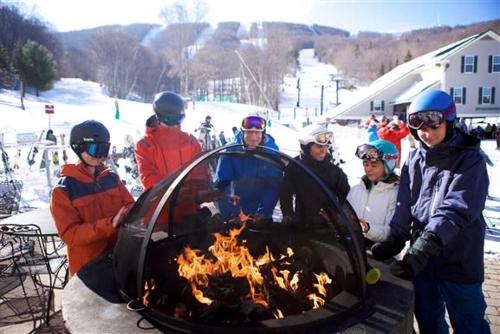 a group of people standing around a fire pit at Gorgeous 1st FL Mtn View Jiminy Suite Sleeps 4 Ski On Off in Hancock