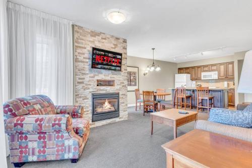 a living room with a couch and a fireplace at Spacious Hideaway in Nature in Edgar