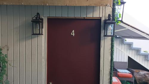 a garage door with the number four on it at Trendy green Cabin in Tijuana
