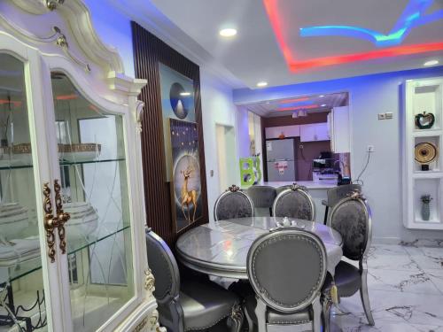 a dining room with a table and chairs at Rovie Estates in Buea