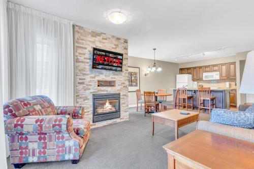 a living room with a couch and a fireplace at Cozy Getaway with Resort Perks in Edgar