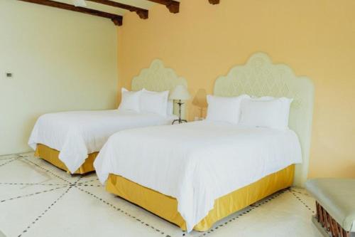 Quinta Real Huatulcoにあるベッド