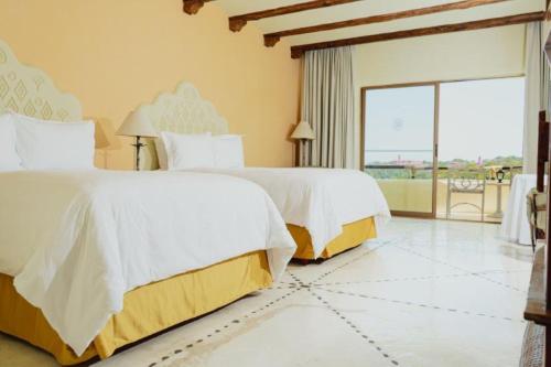 Quinta Real Huatulcoにあるベッド