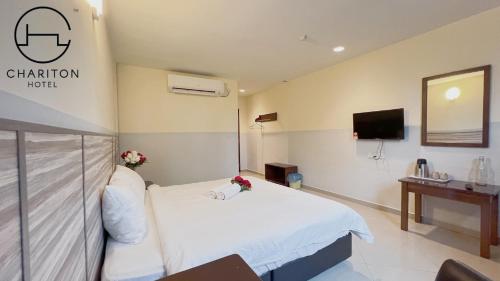 Un ou plusieurs lits dans un hébergement de l'établissement Chariton Hotel Skudai Kiri
