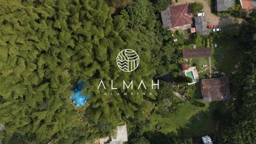 an overhead view of the almn logo in the forest at ALMAH GLAMPING in Cali