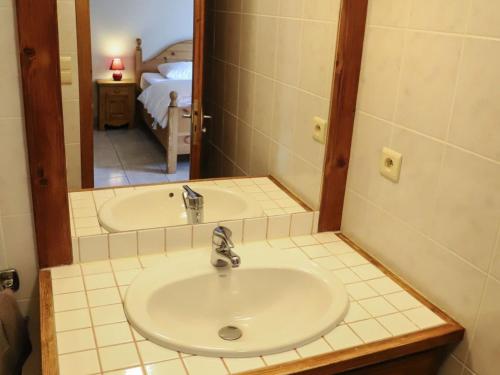 a bathroom with a sink and a mirror at Chalet Châtel, 4 pièces, 9 personnes - FR-1-676-44 in Châtel