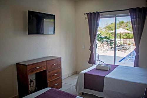 Postel nebo postele na pokoji v ubytování hotel isla Bonita