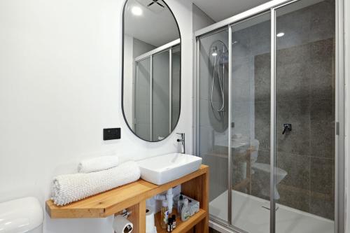 a bathroom with a sink and a shower at Seaspray Getaway in Cape Woolamai