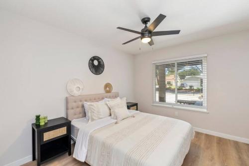 a bedroom with a bed and a ceiling fan at Vineyard Chic Oasis: Modern Elegance near Temecula Wineries in Temecula