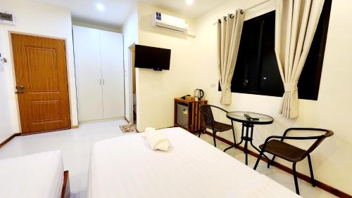 Postel nebo postele na pokoji v ubytování Chotika Hotel โรงแรมโชติกา ณ เชียงคาน