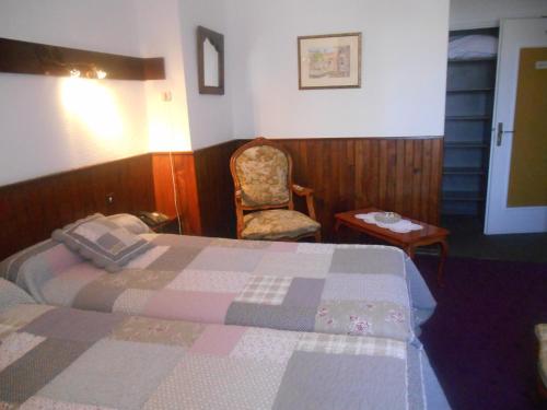 Postel nebo postele na pokoji v ubytování l'echo et l'abbaye
