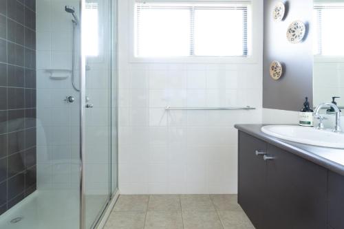 a bathroom with a shower and a sink at Sunset Meadows in Sunset Strip