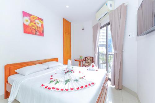 Una cama o camas en una habitación de Ciao Quy Nhơn