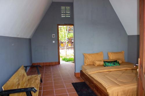 a bedroom with a bed in a room at Sabay Farm in Kampot