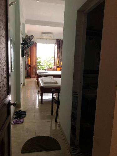 a hallway with a living room and a table at Nhà Nghỉ Hương Thúy - TTTM Royal City in Hanoi