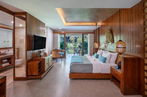 Télévision ou salle de divertissement dans l'établissement Aksari Resort & Spa Ubud by Ini Vie Hospitality