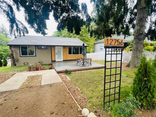 a house with a sign in the yard at Modern Home with Air Conditioners Near Bitter Lake in Seattle