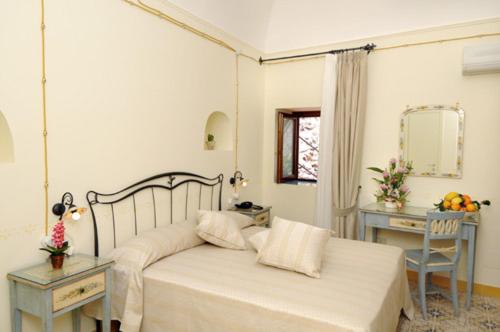 Ένα ή περισσότερα κρεβάτια σε δωμάτιο στο Locanda Degli Dei